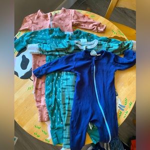 Parade sleepers. Cuffs can flip over to cover hands and feet. Two way zipper.